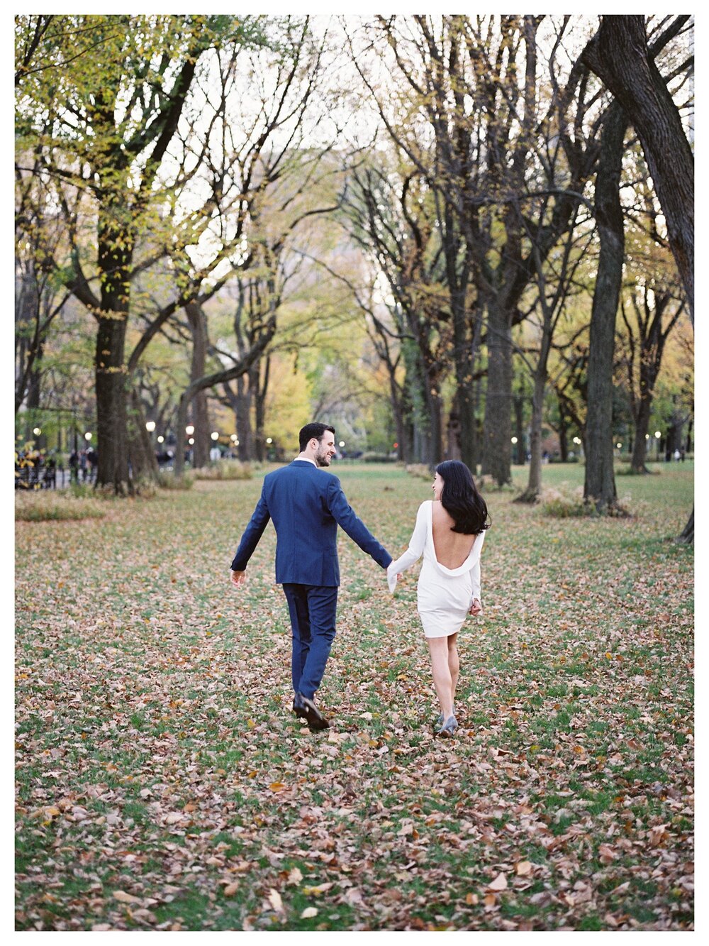  couple walking on the leaves fall in central park 