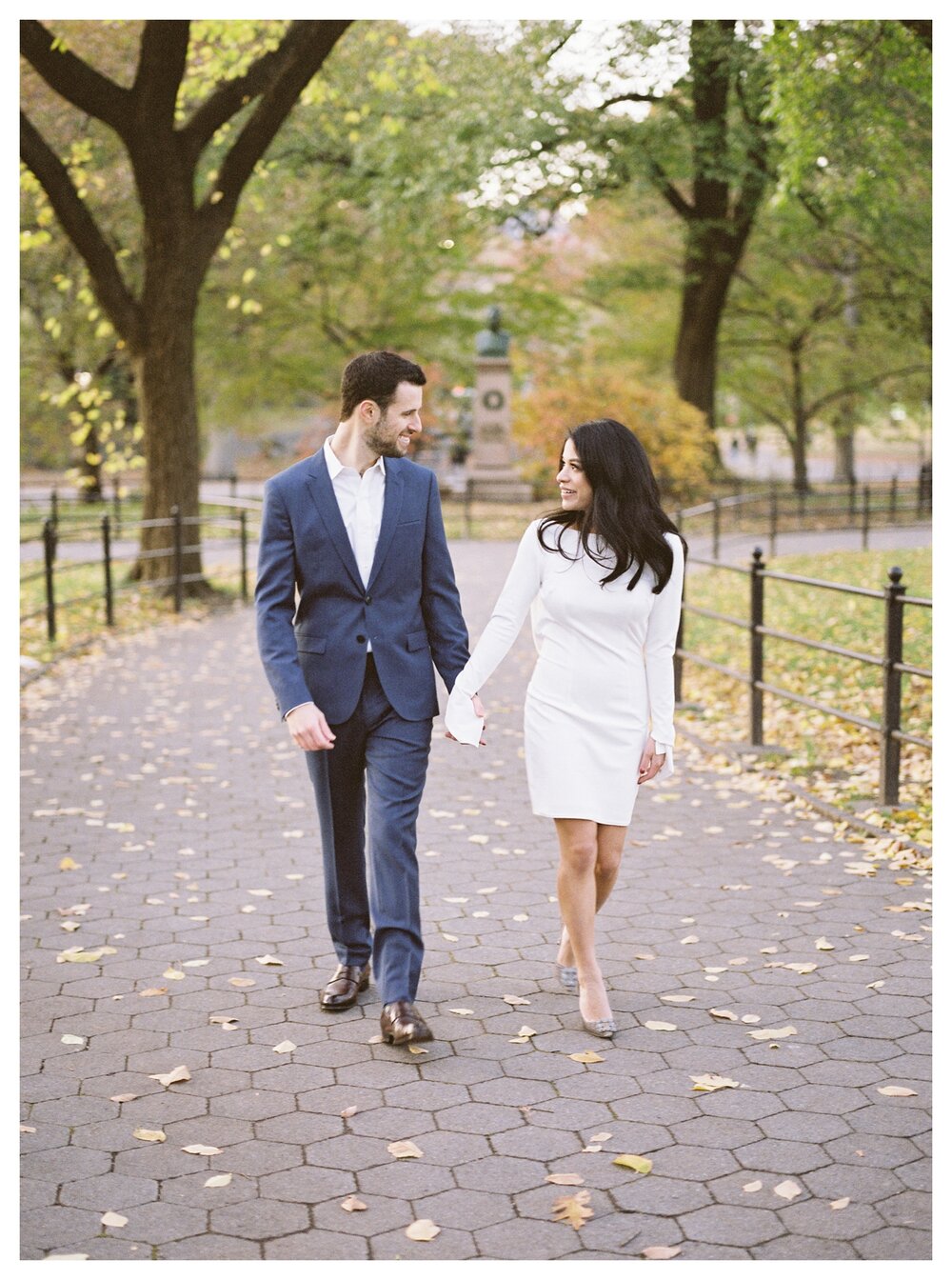  couple walking in central park engagement pictures 