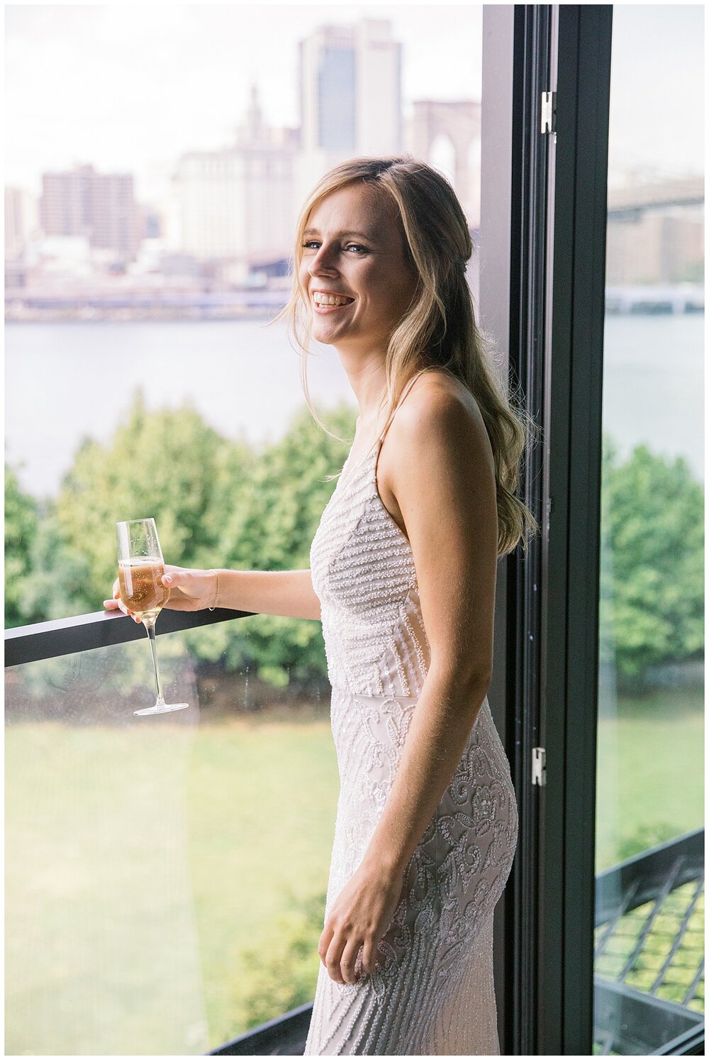  bride getting ready at 1 hotel brooklyn bridge with glass of champagne  