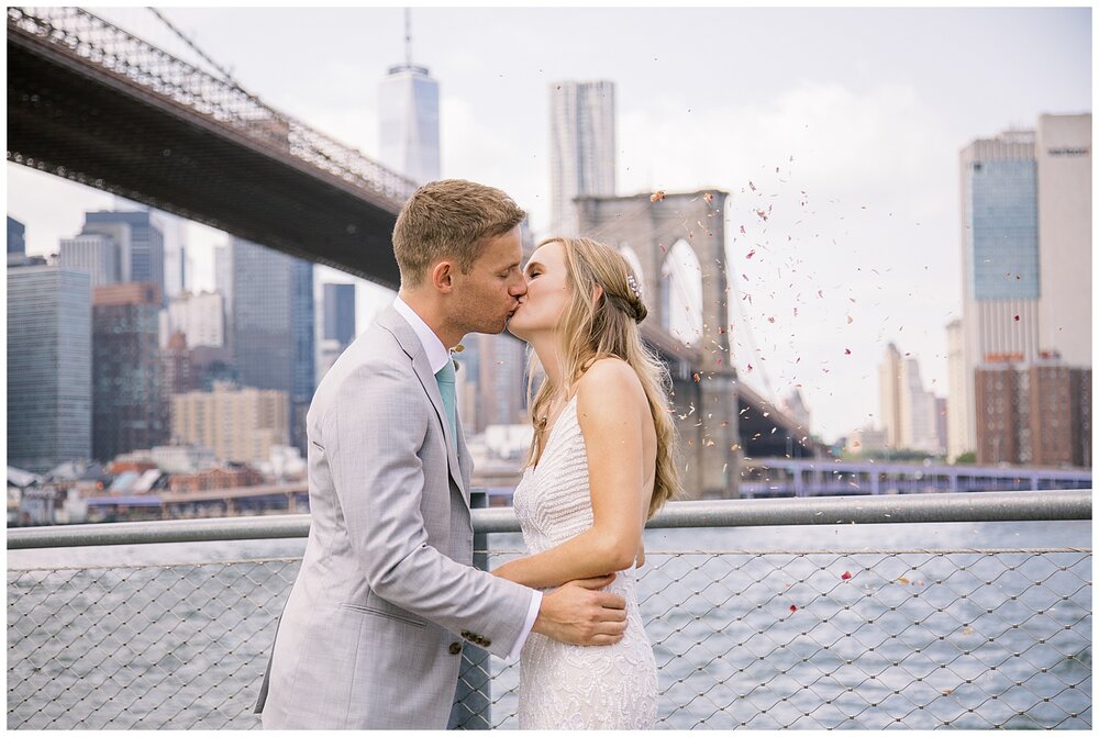  New york city elopement, brooklyn bridge elopement, dumbo micro wedding, bride and groom kissing, wedding ceremony at brooklyn bridge park 