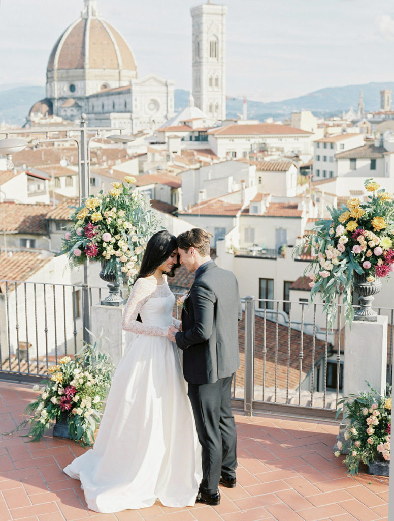 bride and groom wedding ceremony on a rooftop overlooking Florence Duomo